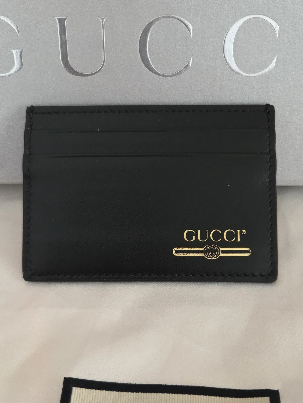 Gucci Black Leather Card Holder with Gold Logo Accent, box and dusty